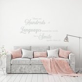 Muursticker There Are Hundreds Of Languages Around The World But A Smile -  Lichtgrijs -  80 x 46 cm  -  alle muurstickers  woonkamer  engelse teksten - Muursticker4Sale