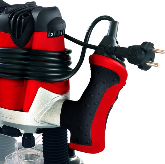 Einhell bovenfrees met rode en zilveren handgrepen, stroomstekker zichtbaar.