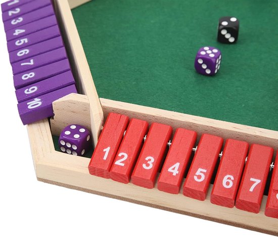 Detail van houten shut the box spel: paarse schuifjes genummerd 1-10, rode schuifjes genummerd 1-7 en een paarse dobbelsteen.