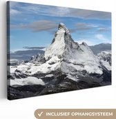 Canvas Schilderij Wolken boven de Matterhorn in Zwitserland - 120x80 cm - Wanddecoratie