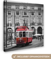 Canvas Schilderij Zwart-wit foto met een rode tram - 90x90 cm - Wanddecoratie