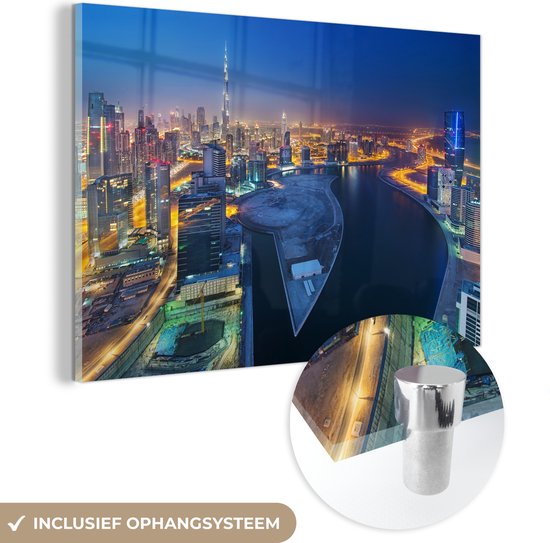 MuchoWow® Glasschilderij 180x120 cm - Schilderij acrylglas - Dubai als een schitterende lichtgevende stad in de nacht - Foto op glas - Schilderijen