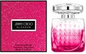 Set van Jimmy Choo Blossom: roze glinsterende doos naast de glazen parfumfles.