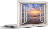 Laptop sticker - 10.1 inch - Doorkijk - Zee - Strand - Zonsondergang - Blauw - 25x18cm - Laptopstickers - Laptop skin - Cover