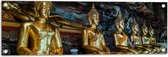 Tuinposter – Rijen Gouden Boeddha's in Wat Tham Khuha Sawan Tempel in Thailand - 90x30 cm Foto op Tuinposter (wanddecoratie voor buiten en binnen)