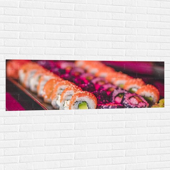 Muursticker - Schaal Vol met Verschillende Smaken Sushi in Paars Licht - 150x50 cm Foto op Muursticker