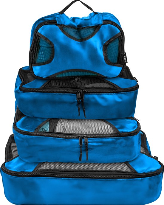 Stapel van vier blauwe packing cubes, van klein naar groot, met mesh en ritsen.