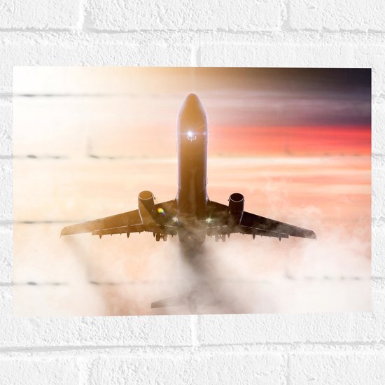 Muursticker - Passagiersvliegtuig bij Zonsondergang door de Wolken - 40x30 cm Foto op Muursticker