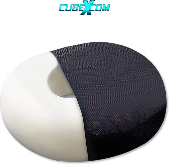 Een donutvormig kussen, deels wit en deels bedekt met een zwart rasterpatroon.