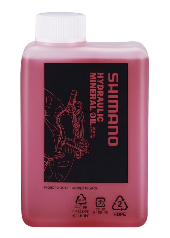 Fles Shimano hydraulische minerale olie met roze vloeistof. Zwart etiket met witte tekst "SHIMANO HYDRAULIC MINERAL OIL".