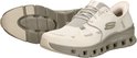 Witte Skechers Glide-Step Pro instappers met grijze zool en veters.