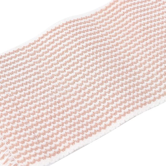Close-up van een beige en witte elastische bandage.