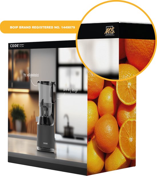Vue de dessus d'une centrifugeuse lente noire dans une cuisine. Une découpe circulaire montre le logo de la marque BOIP sur un bord noir et une pile d'oranges.