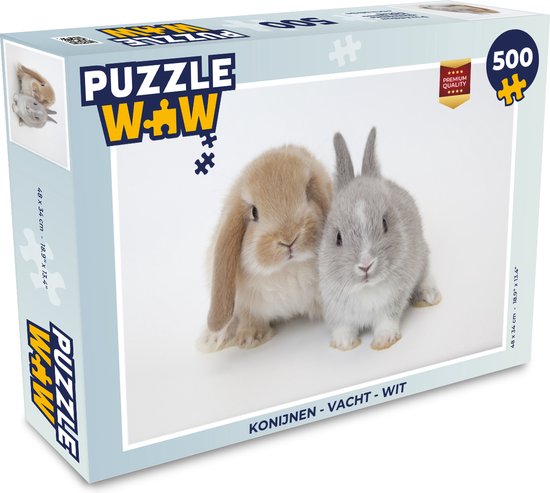 Boîte de puzzle de 500 pièces représentant deux lapins, un brun et un gris, sur fond blanc. La boîte indique "Konijnen - Vacht - Wit".