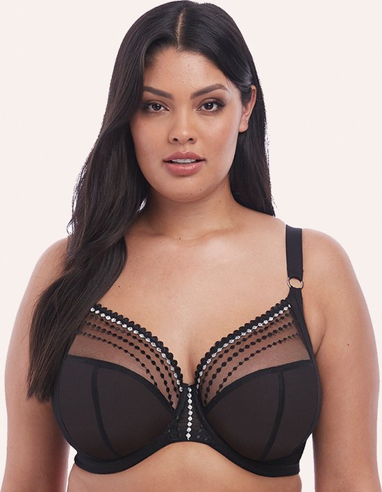 Model draagt een zwarte plunge beha met doorschijnende cups, versierd met stippenlijnen.