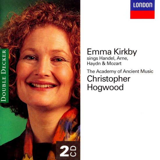 Emma Kirkby met krullend rood haar, lachend, in een zwart en oranje sjaal. Titel: Emma Kirkby zingt Handel, Arne, Haydn & Mozart.