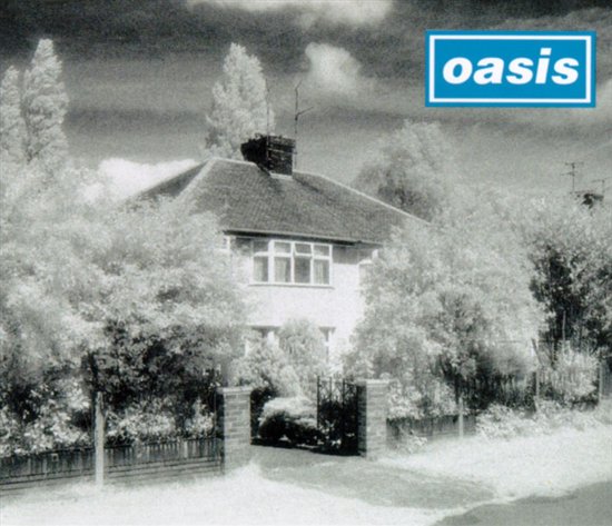 Een huis met bomen ervoor, met het Oasis-logo.
