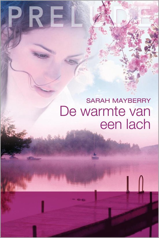 Boekcover 'De warmte van een lach' met een vrouwengezicht en een mistig meer bij zonsopgang.