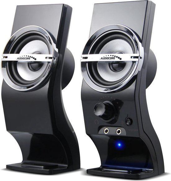 Twee zwarte compacte speakers met zilveren ringen en 'Audiocore' logo, geïsoleerd op witte achtergrond.