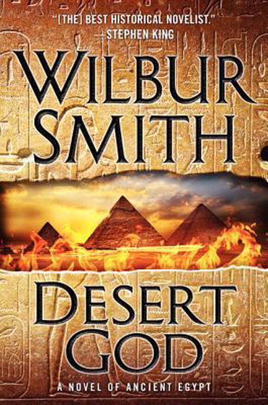 Boekomslag van "Desert God" van Wilbur Smith. De tekst "Wilbur Smith Desert God" staat centraal, met piramides en vlammen op de achtergrond.