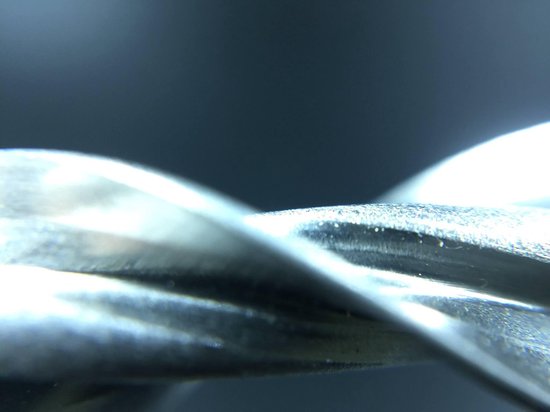 Abstracte close-up van de gedraaide schachten van metalen ankers.