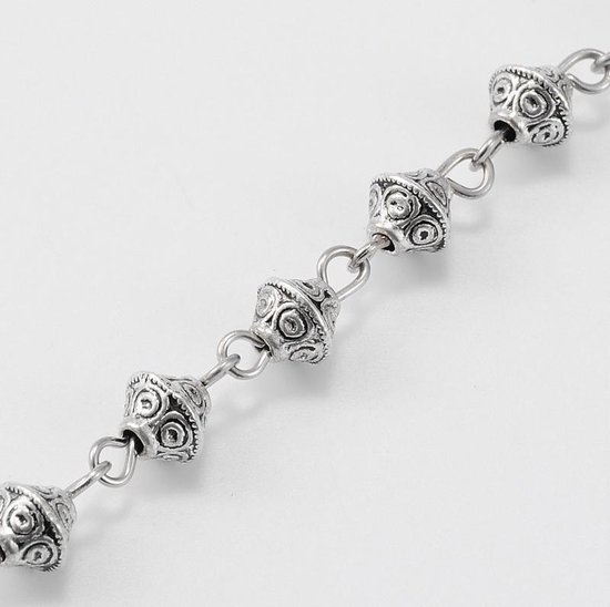 Handgemaakte zilveren metalen ketting bestaande uit 6mm cone kralen,  verbonden met... | bol.com