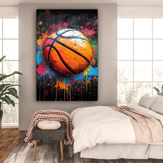 Peinture d'un ballon de basket éclaboussé de touches de peinture vive.
