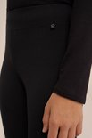 Zwarte legging met een klein wit sterlogo op de achterkant.