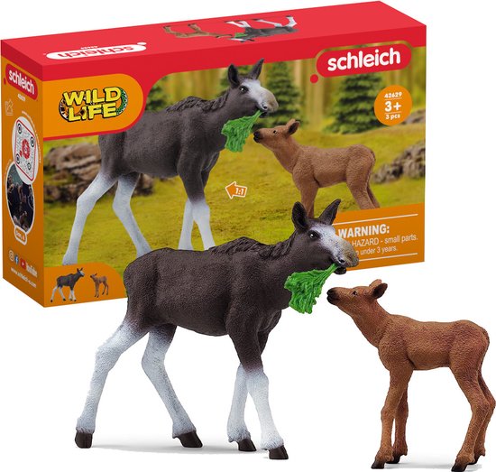 Schleich elandkalf en moeder eland met groen voer, naast de verpakking.