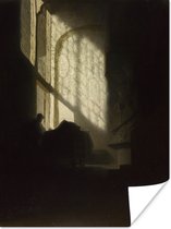Poster Een man lezend in een hoge kamer - Rembrandt van Rijn - 60x80 cm