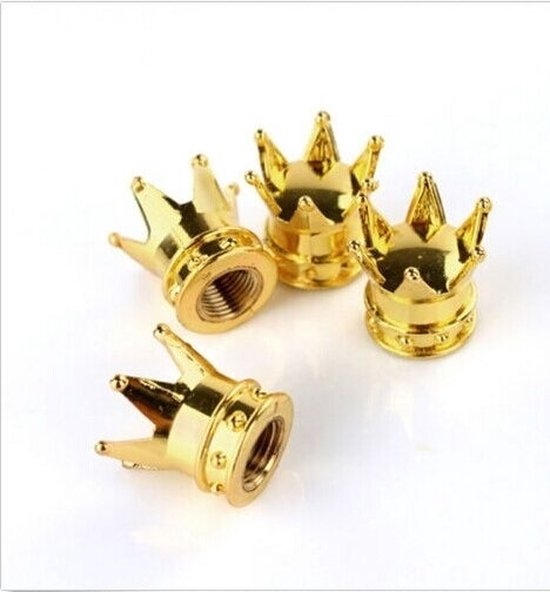 Quatre capuchons de valve dorés en forme de couronne avec un filetage et de petites perles autour de la base.