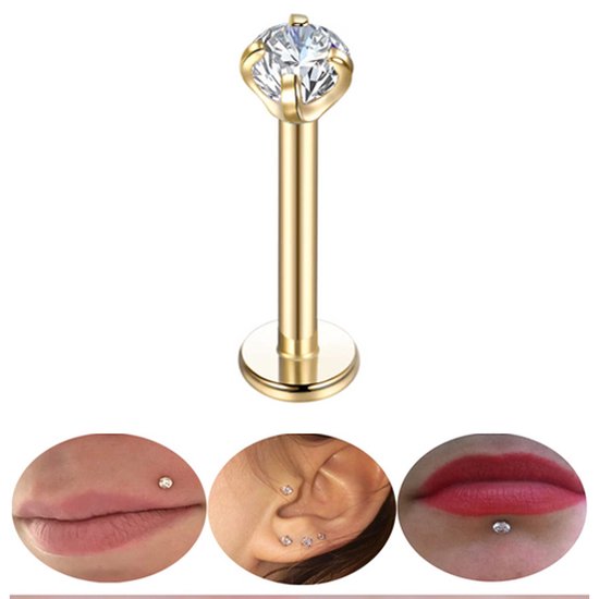 Gouden labret piercing met helder steentje, gedragen in lip, oor en lip.