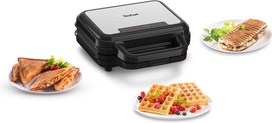 Tefal wafelijzer met een tosti, panino en wafels met fruit op witte borden.
