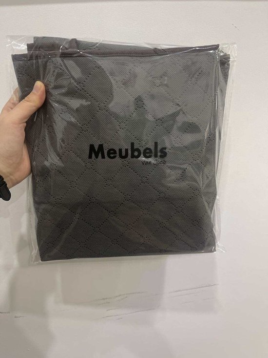 Grijze opbergdoos van MeubelsvanJoep, gevouwen in plastic verpakking.