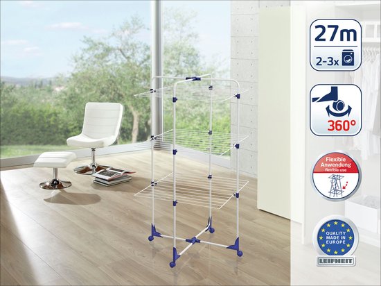 Witte droogtoren met blauwe details in een lichte kamer, met tekstballonnen.