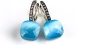 Zilveren oorringen oorbellen model pomellato gezet met lichtblauwe steen