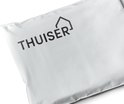 Witte verpakking met het zwarte THUISER logo.