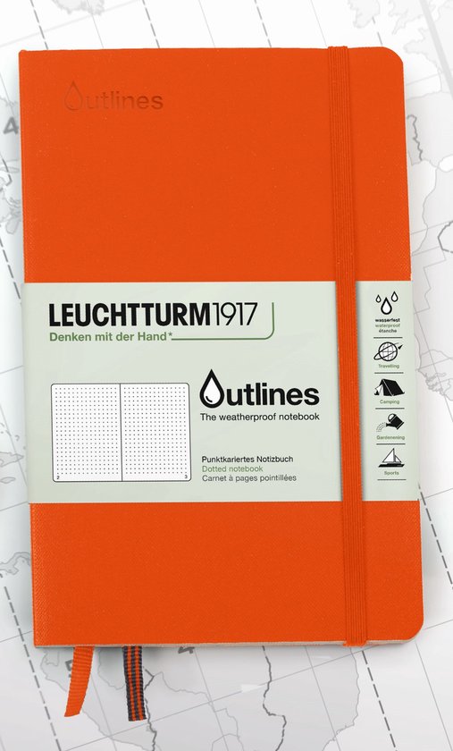 Un carnet Leuchtturm1917 Outlines orange sur une carte.
