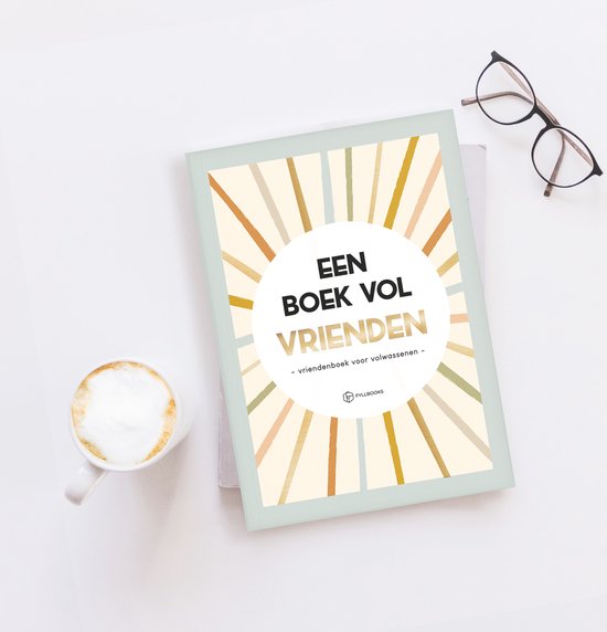 Boek 'Een boek vol vrienden' op een tafel met een koffiekopje en een bril.