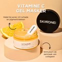 Gouden gelmasker in een potje, met sinaasappelschijfjes en de tekst "VITAMINE C GEL MASKER".