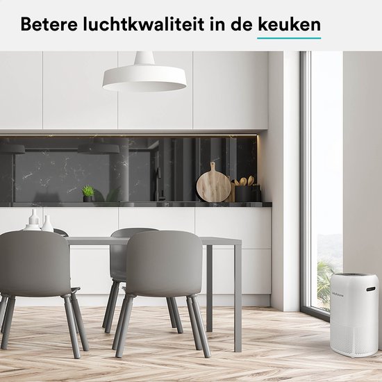 Een Rolfstone luchtreiniger in een moderne keuken met een eettafel.