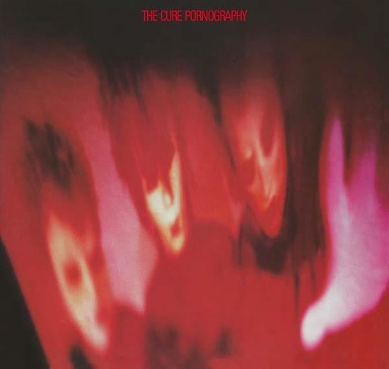 Albumhoes van 'The Cure Pornography' met rode en paarse abstracte beelden. Tekst 'The Cure Pornography' in rode letters.