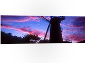WallClassics - PVC Schuimplaat- Silhouet van Grote Molen onder Donkere Zonsondergang - 120x40 cm Foto op PVC Schuimplaat