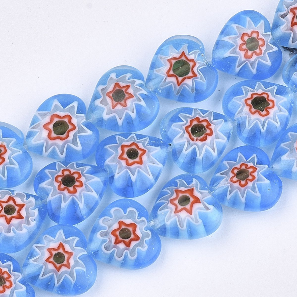 Millefiori glas, Venetië, hart-kralen, 12x12x5mm, lichtblauw. Verkocht per streng van ca. 38 cm.