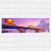 Muursticker - Paarse Lucht boven Verlichte Dragon brug in Da Nang, Vietnam - 60x20 cm Foto op Muursticker