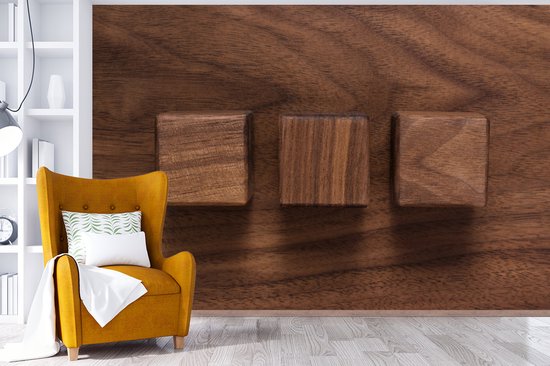 Cubes en bois sur un fond en bois fotobehang