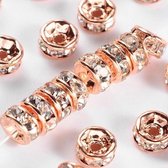 Rhinestone spacer beads, rose goud met heldere chatons, 6x3mm. Verkocht per 50 stuks !
