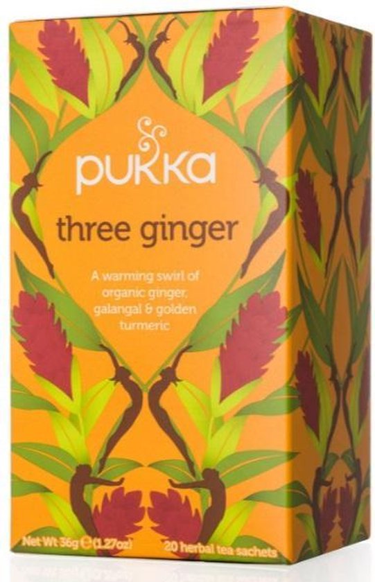 Pukka three ginger thee verpakking met oranje achtergrond en afbeeldingen van gemberbloemen en bladeren.