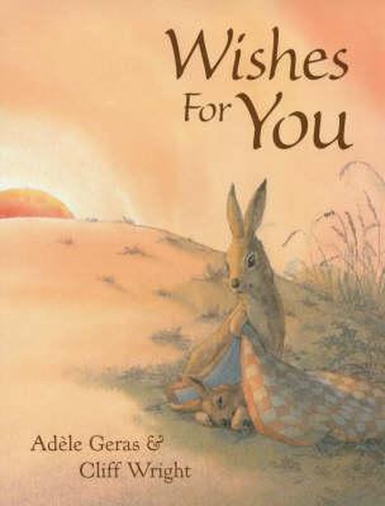Boek 'Wishes For You' met een konijn en haar baby, onder een plaid, bij zonsondergang.