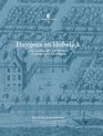 Boekcover met blauwe gravure van een landhuis, tuin en water met boot. Titel: Huygens en Hofwijck.